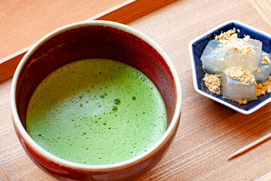 A fresh cup of frothy green tea.